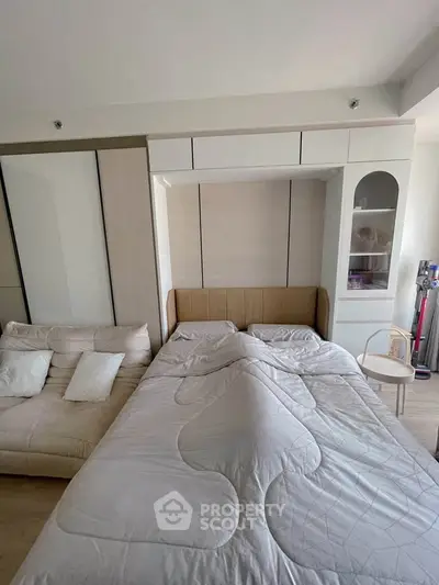 Cozy bedroom with modern furniture and ample storage space