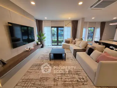 Spacious modern living room with stylish decor and large windows