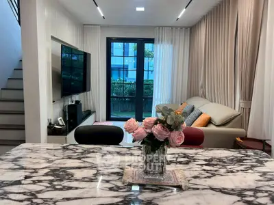 Luxurious living room with marble table, elegant sofa, and modern decor in a stylish apartment.
