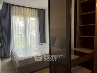 Modern bedroom with large window and stylish decor