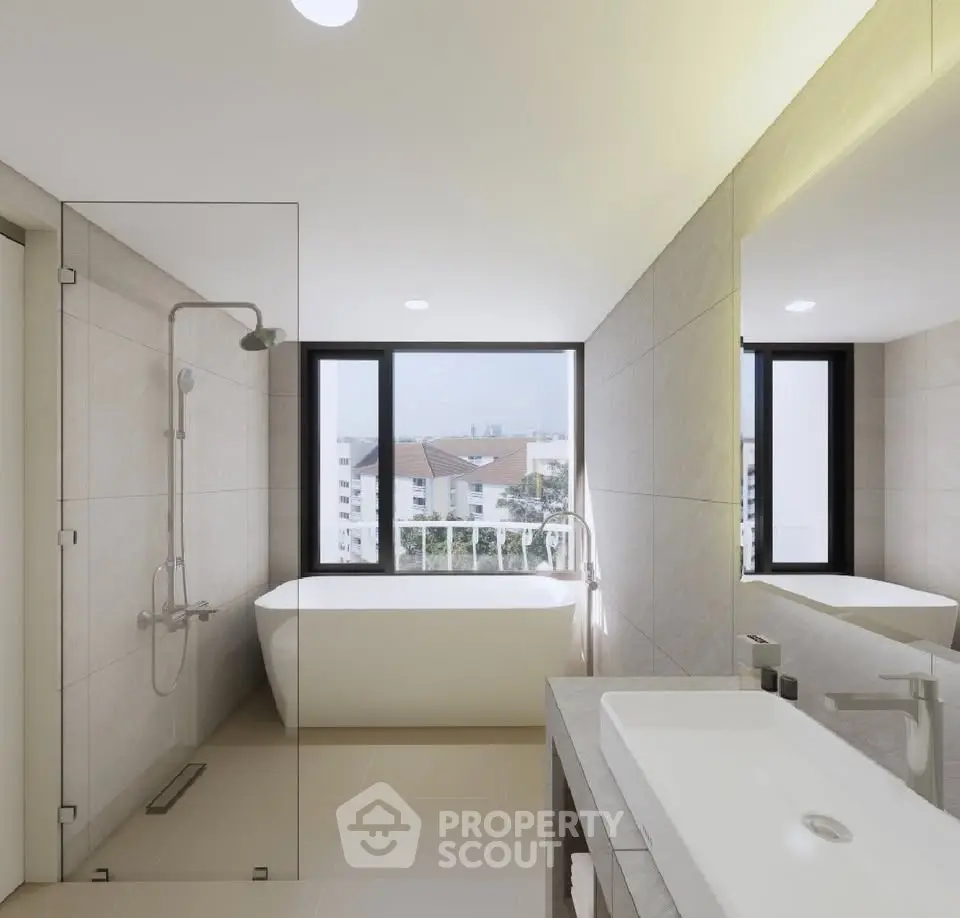 Luxurious bathroom with modern fixtures and a stunning city view from the window.
