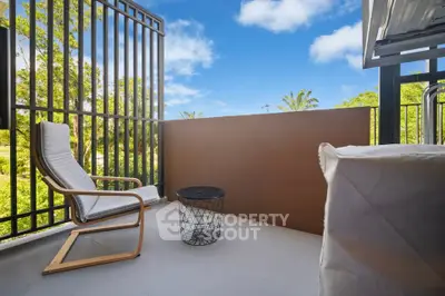 Charming balcony with lush greenery view, perfect for relaxation and outdoor enjoyment.