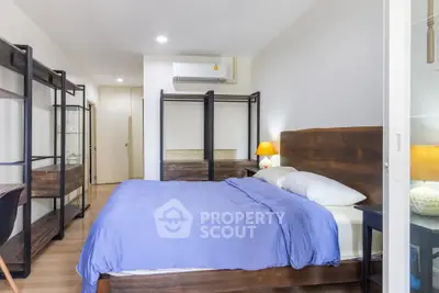 Spacious bedroom with modern furnishings and cozy ambiance, perfect for relaxation and comfort.