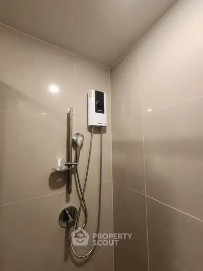 Modern bathroom shower with sleek design and neutral tiles