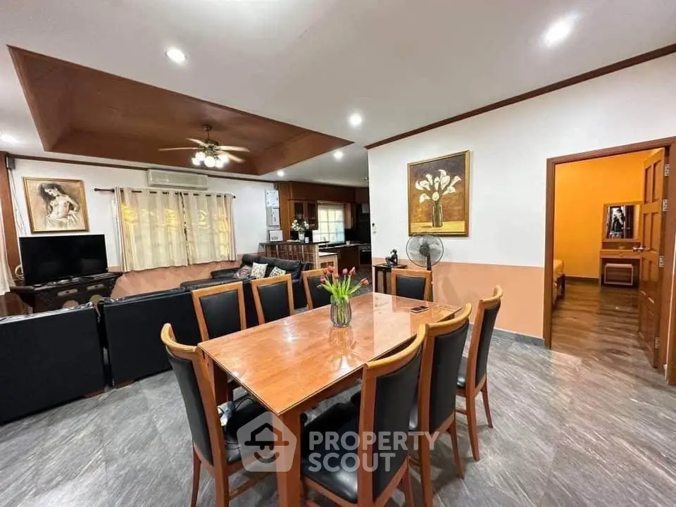 Spacious living and dining area with modern decor and open layout