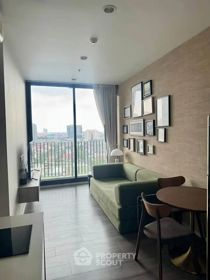 Modern living room with stylish decor and city view from large window.