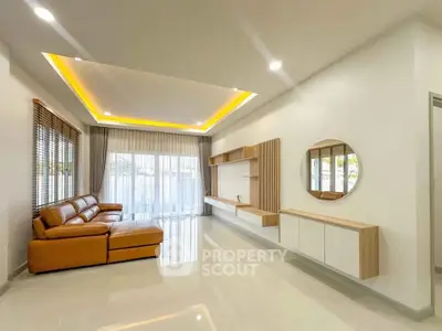 Spacious modern living room with elegant lighting and stylish furniture