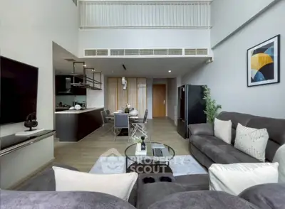 Spacious modern living room with open kitchen and stylish decor