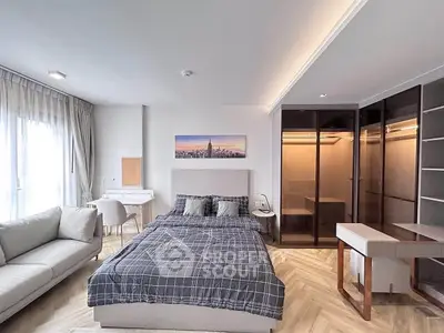 Modern bedroom with stylish decor and walk-in closet in luxury apartment