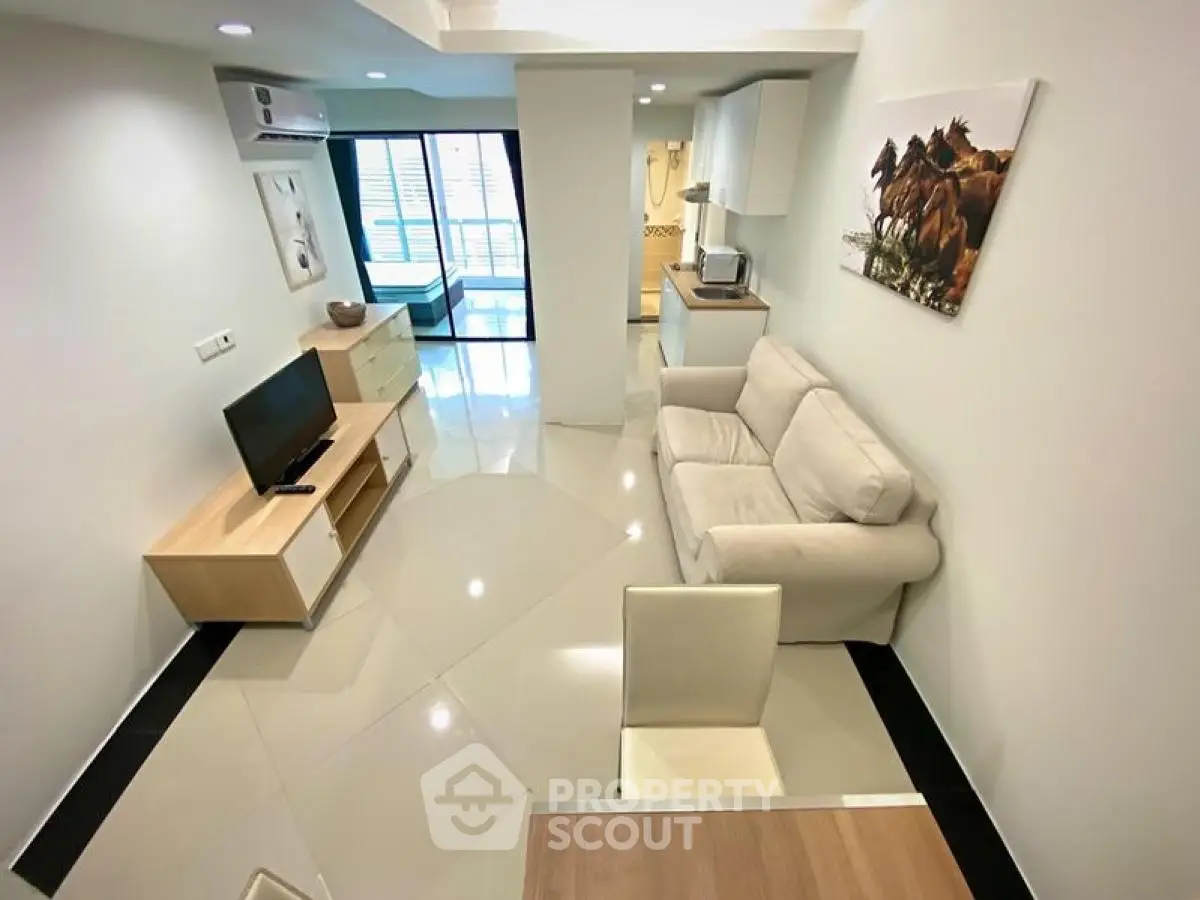 Modern living room with sleek furniture and open layout, perfect for urban living.