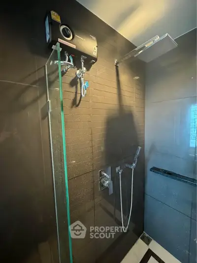 Modern bathroom with sleek shower fixtures and glass enclosure