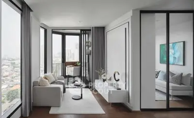 Modern living room with city view, featuring sleek furniture and floor-to-ceiling windows.