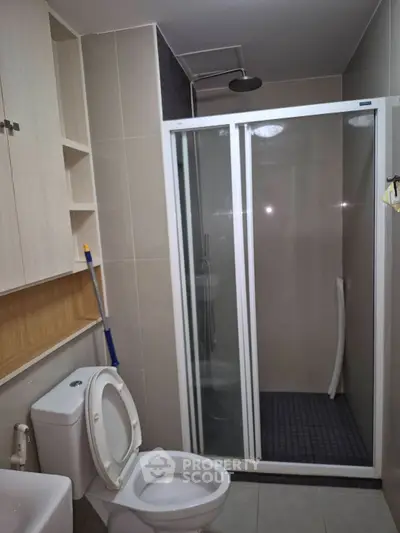 Modern bathroom with shower and toilet in sleek design