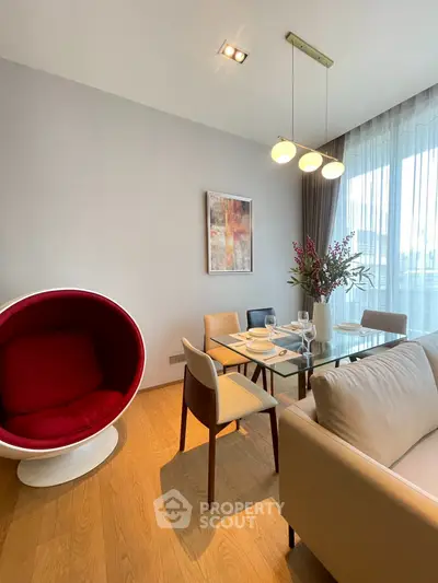 Modern living room with stylish furniture and elegant dining area