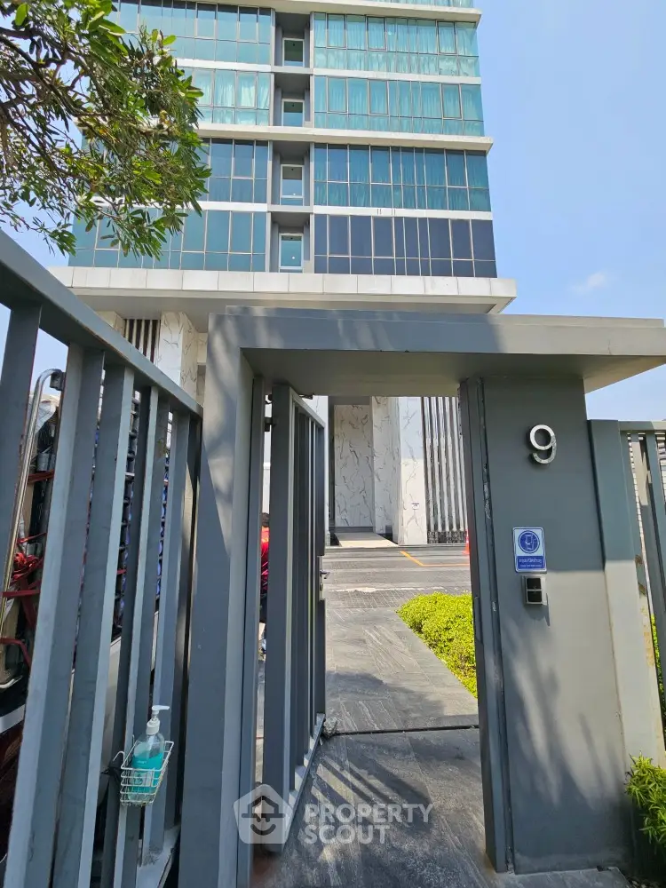 Modern high-rise building entrance with sleek design and secure access