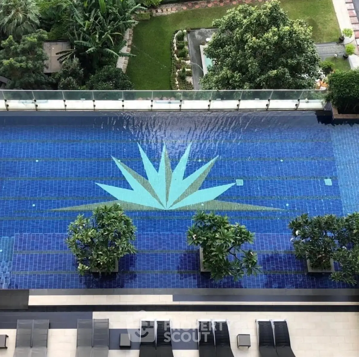 Luxurious rooftop pool with stunning design and lush greenery, perfect for relaxation and leisure.