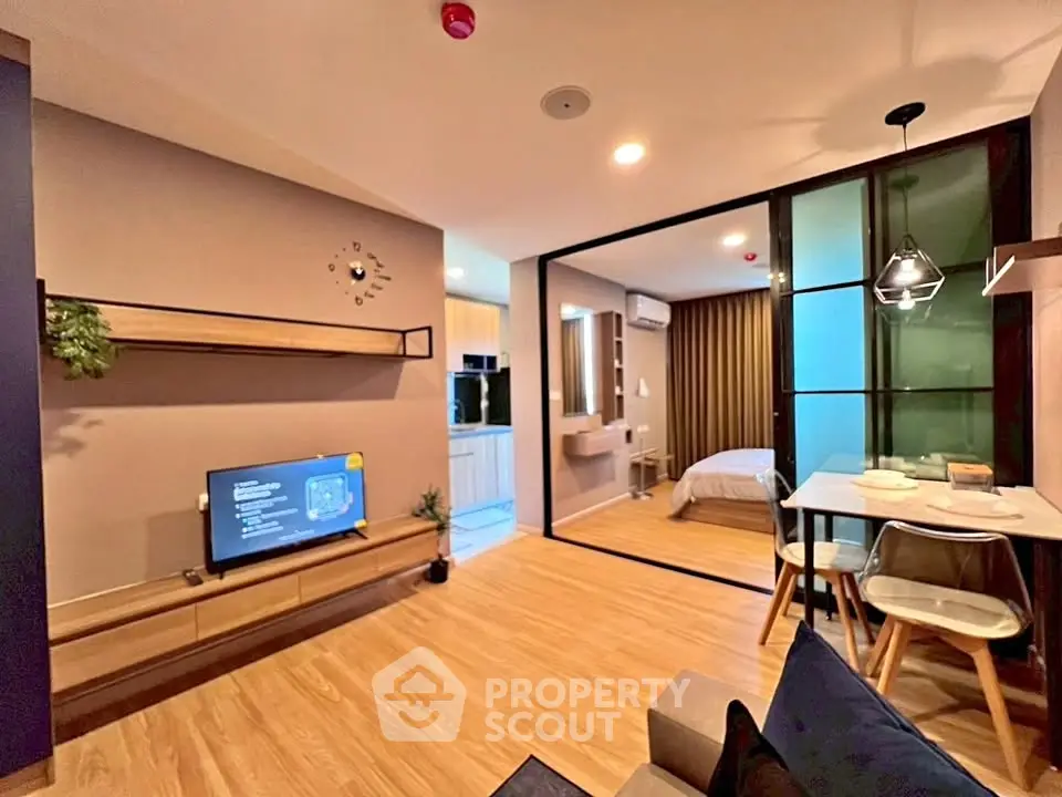 Modern open-plan living room with stylish decor and cozy dining area