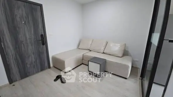 Modern minimalist living room with sleek furniture and wooden flooring