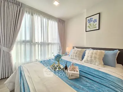 Cozy bedroom with soft blue accents and natural light