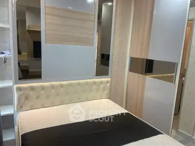 Modern bedroom with stylish decor and built-in storage solutions