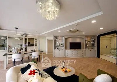 Luxurious open-plan living room with elegant dining area and modern decor.