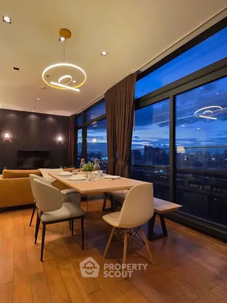 Luxurious dining area with stunning city view and modern lighting
