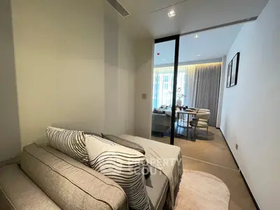 Modern living room with stylish decor and cozy seating area in a contemporary apartment.