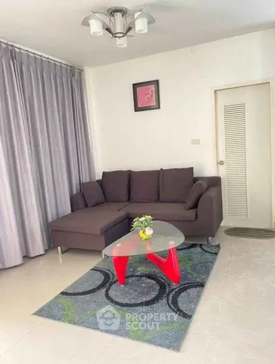 Modern living room with stylish sofa and unique coffee table in a cozy apartment.