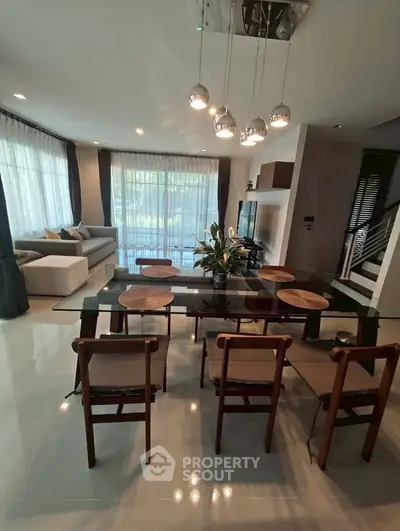 Spacious modern living room with elegant dining area and natural light