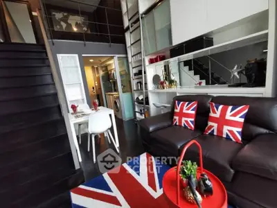 Stylish modern living room with loft design and British-themed decor