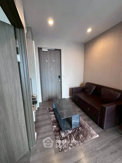 Modern living room with sleek furniture and stylish decor in a contemporary apartment.