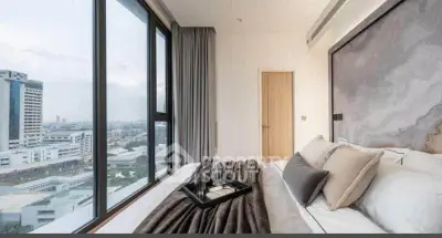 Luxurious bedroom with stunning city view and modern decor