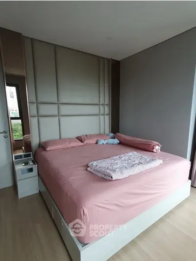 Modern bedroom with stylish decor and large window view