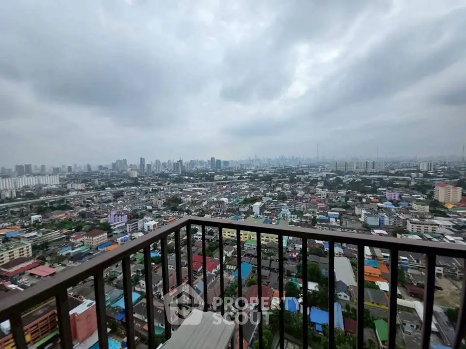 Stunning cityscape view from high-rise balcony showcasing urban skyline.