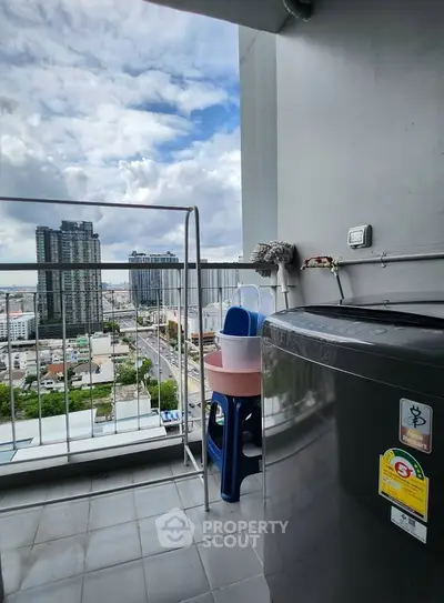 High-rise balcony with city view and washing machine, perfect for urban living.
