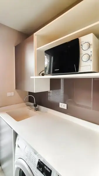 Modern kitchen with sleek appliances and stylish countertop