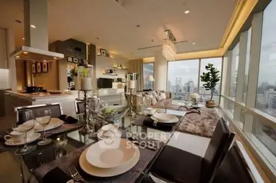 Luxurious open-plan living and dining area with stunning city views and elegant decor.
