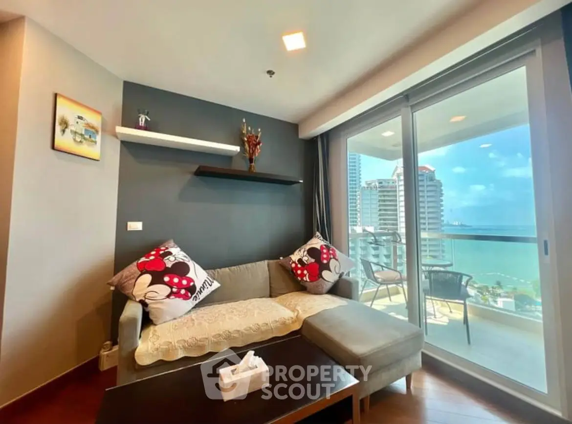 Modern living room with ocean view balcony in luxury apartment