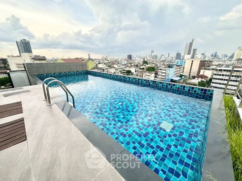 Stunning rooftop pool with panoramic city views, perfect for relaxation and leisure.