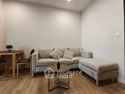 Modern living room with cozy gray sofa and stylish coffee table