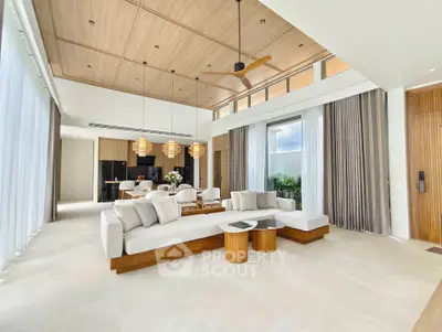 Luxurious open-plan living room with high ceilings and modern decor
