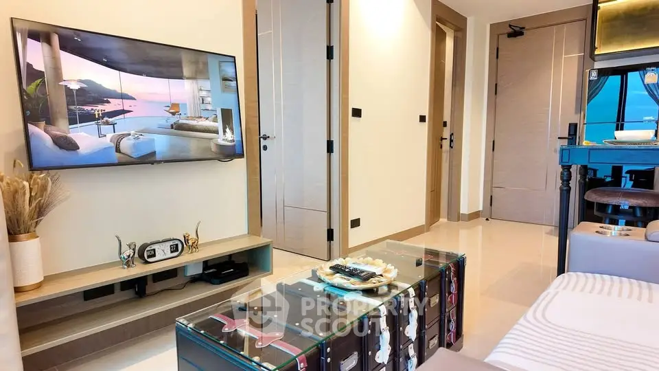 Modern living room with stylish decor and wall-mounted TV in luxury apartment