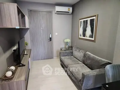 Modern living room with sleek furniture and stylish decor in a cozy apartment.