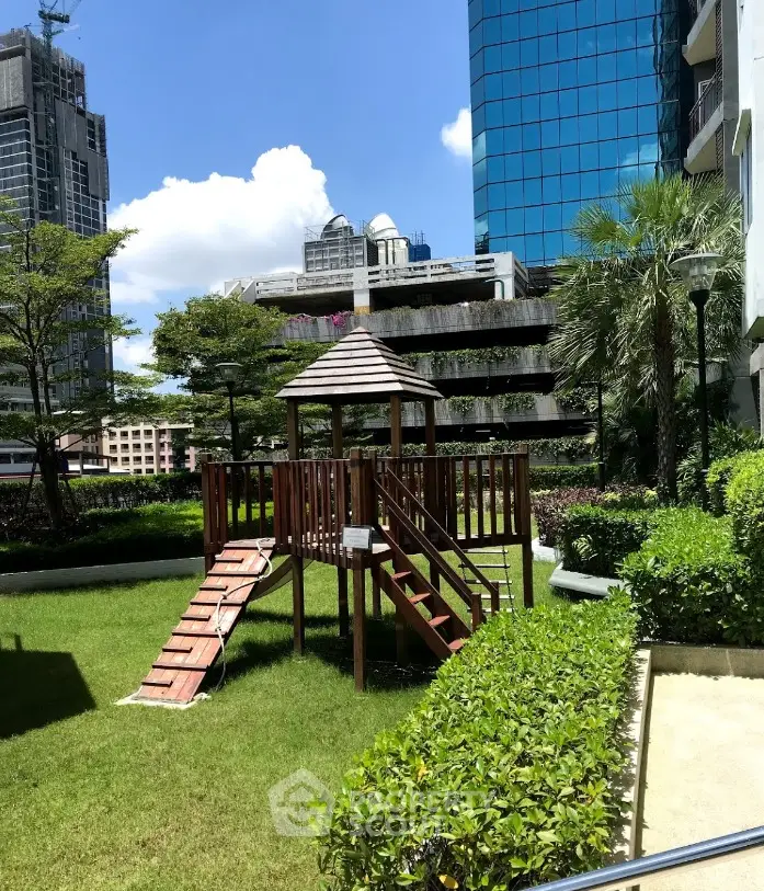 Charming urban garden with playground in modern residential complex