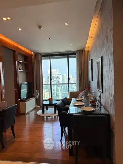 Modern living room with dining area and city view from large windows.