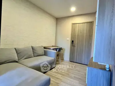 Modern living room with cozy sofa and stylish decor in a contemporary apartment.