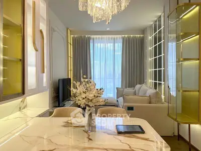 Luxurious modern living room with elegant chandelier and marble dining table