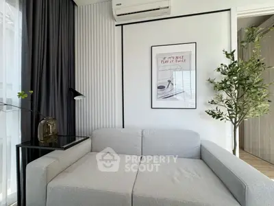 Modern living room with sleek gray sofa and stylish decor