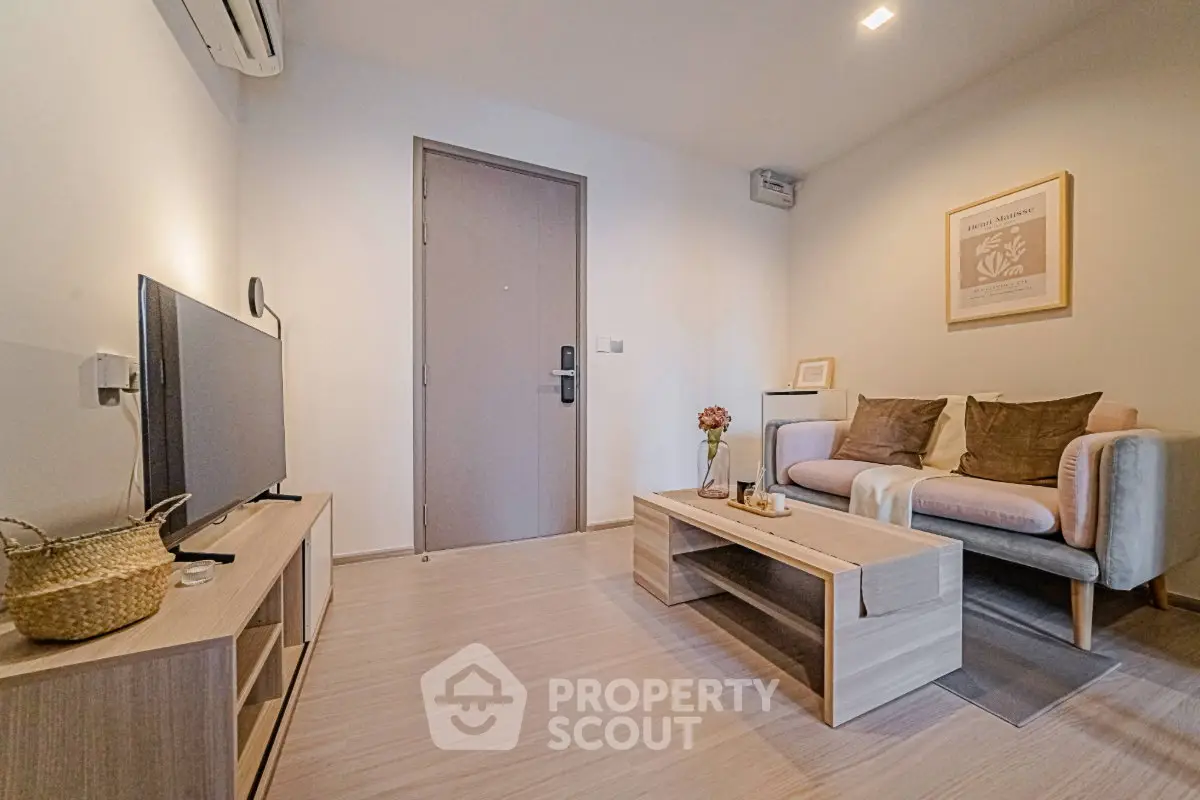 Modern living room with stylish decor and cozy seating area, perfect for relaxation and entertainment.