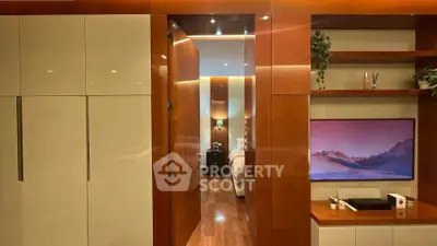 Luxurious modern bedroom with wooden accents and sleek built-in storage